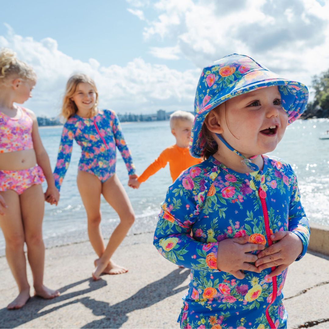 kids wearing ocean tales at beach