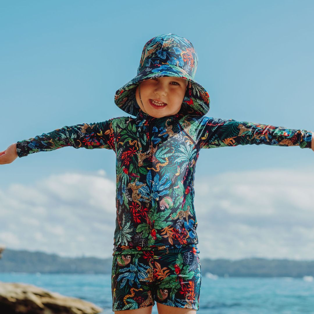 boy wearing ocean tales matching 
swimwear 