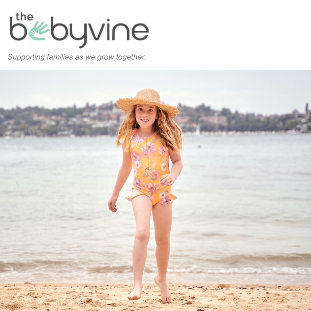 girl running on beach in swimsuit