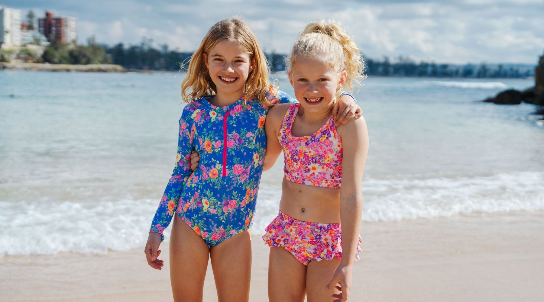 sisters at beach wearing ocean tales